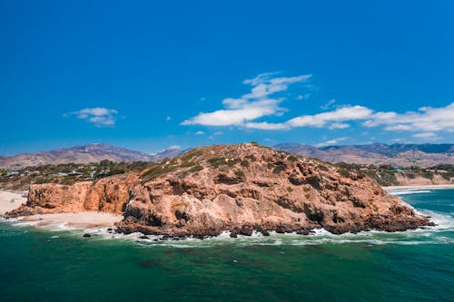 An Aerial Photography of a Natural Rock Formations Near the Beach