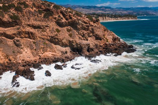 Brown Rock Formation Beside Body of Water