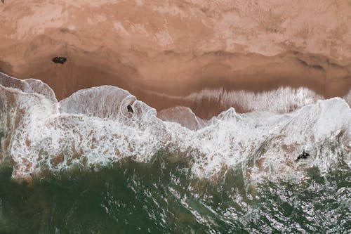 Top View of Sea Waves Crashing on Beach Shore