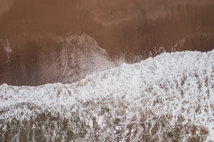 An Ocean Waves Crashing On Shore