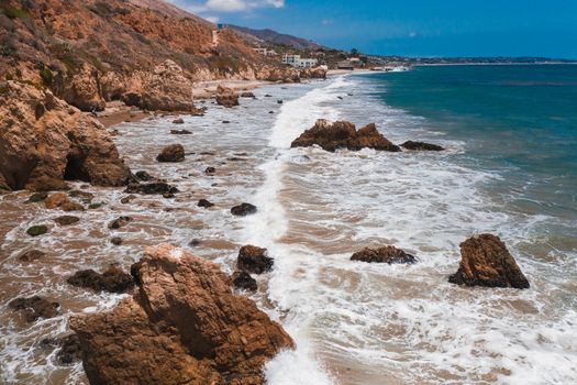 Brown Rock Formation Near Body of Water