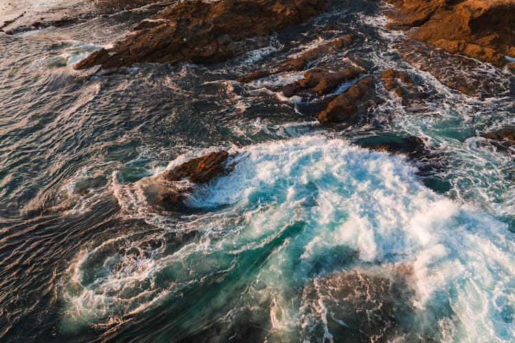 Ocean Waves Crashing On Rocky Coast