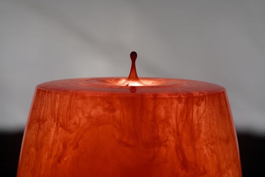 Dynamic close-up of an orange liquid splash, capturing a serene yet vibrant moment.