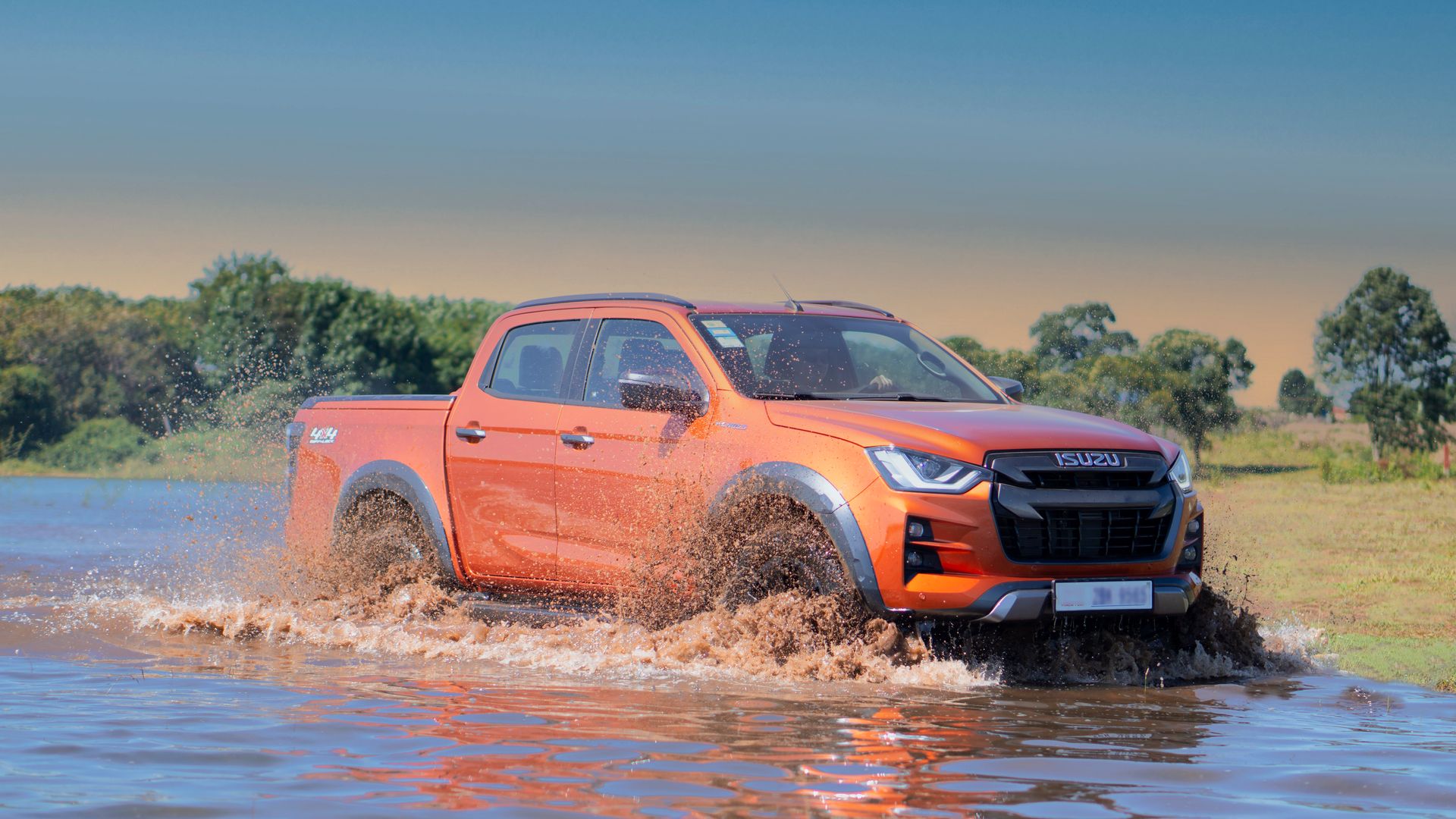 Orange Isuzu D'MAX Pickup Truck on Water