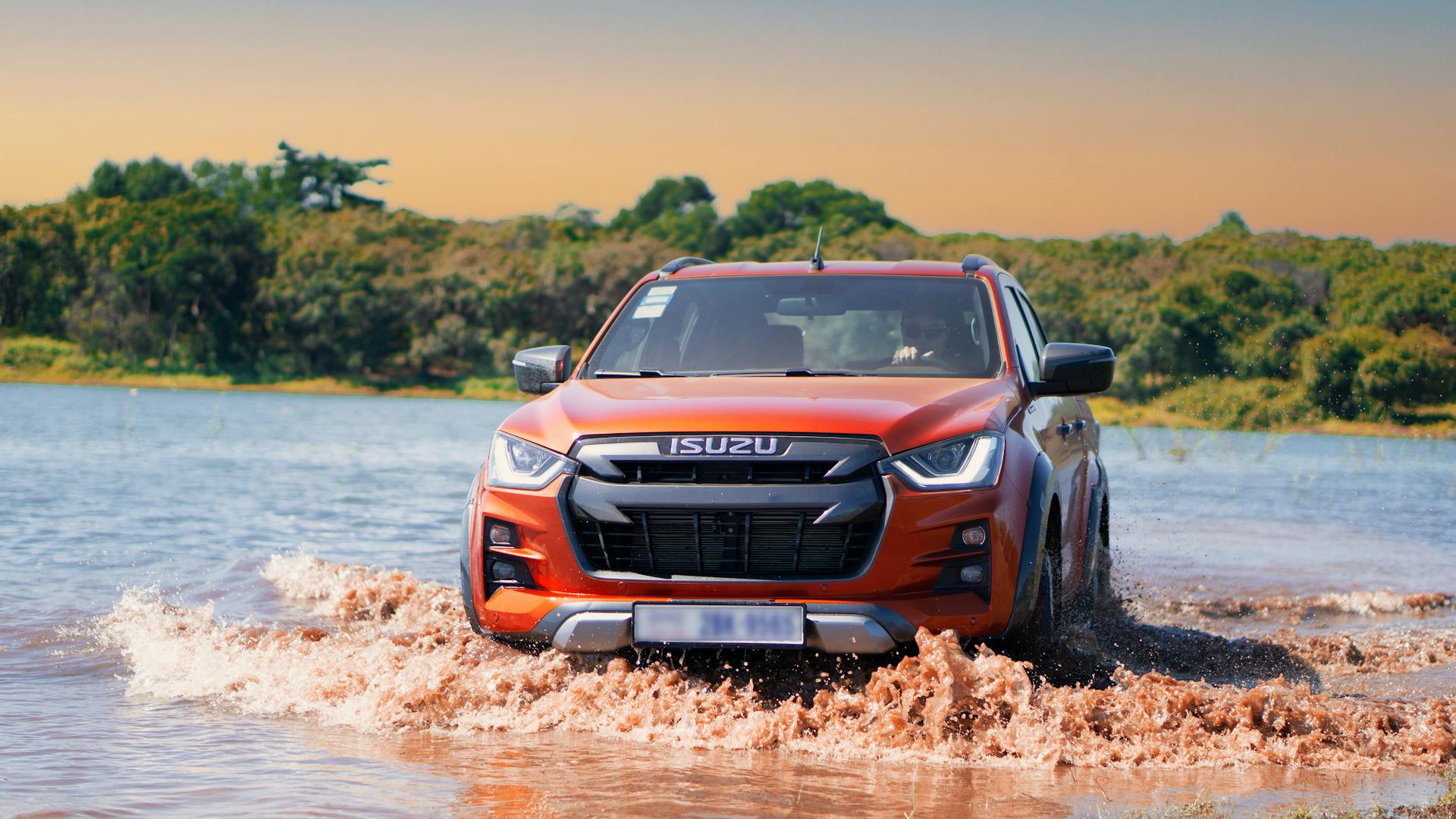 Man Driving Isuzu D'MAX Pickup on Water