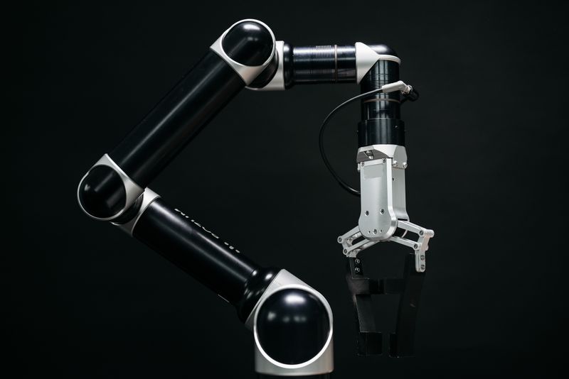 Industrial robotic arms with parallel grippers already handle picking, kitting, and sorting tasks that Avatar aims to scale across logistics and manufacturing.