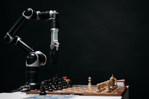 Free A Robotic Arm and a Chessboard Stock Photo