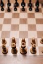 Brown Chess Piece on Brown and White Checkered Textile