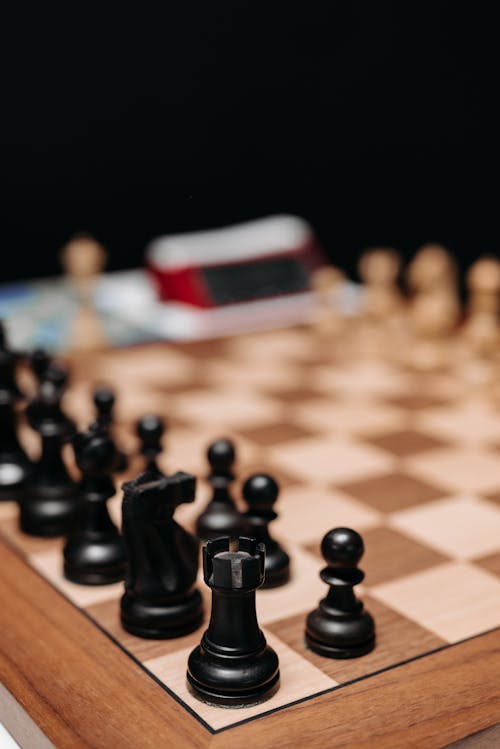 Black Chess Pieces on Chess Board