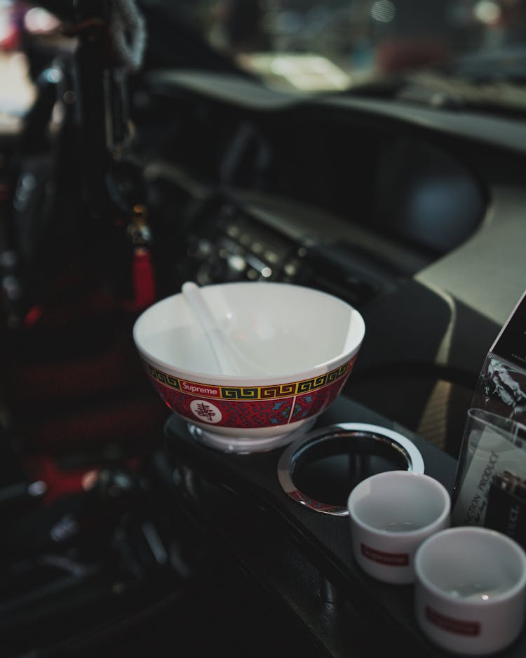 Ceramic Bowl And Teacups Inside A Car