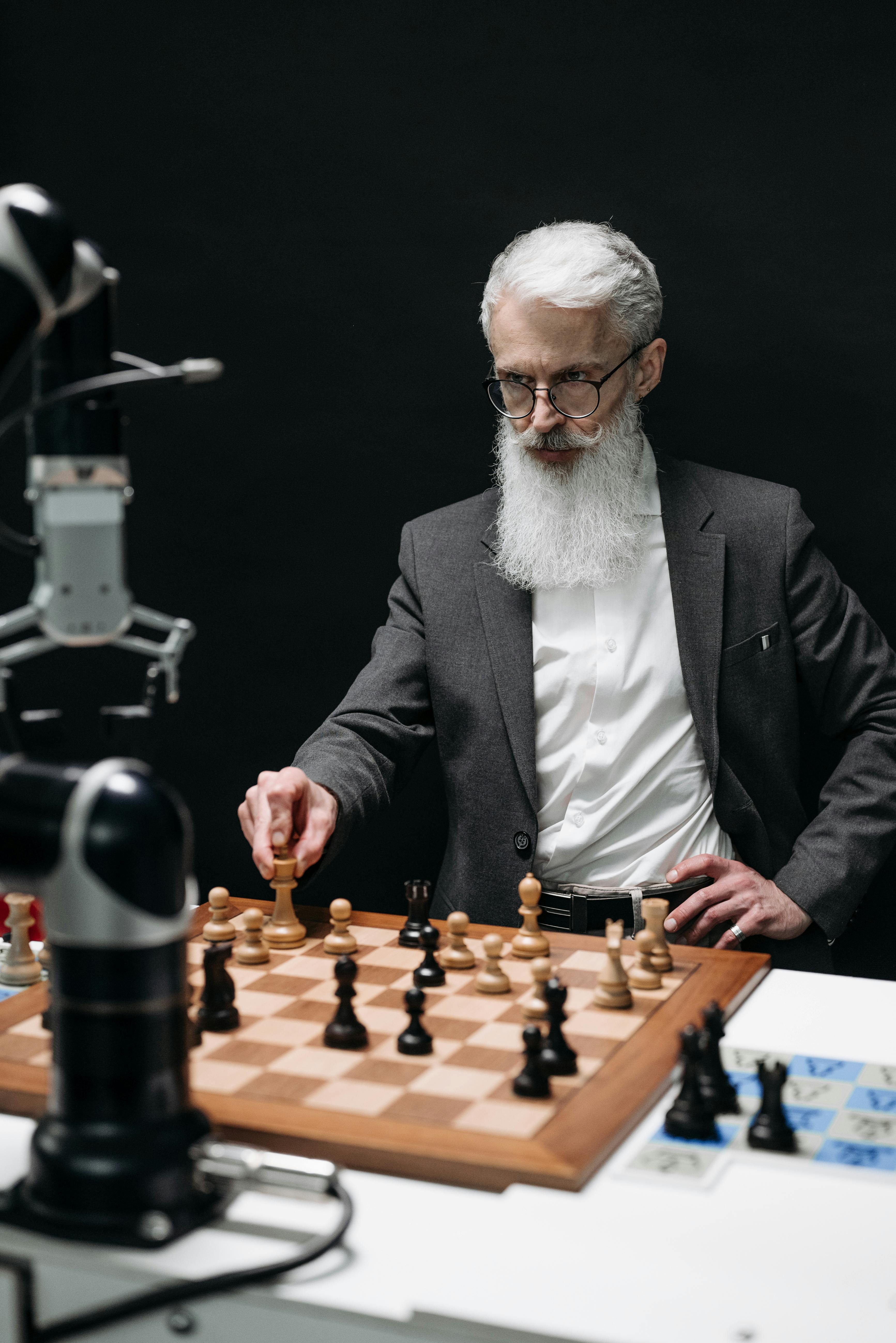 Man playing chess against computer Stock Photo by ©STYLEPICS 11294363