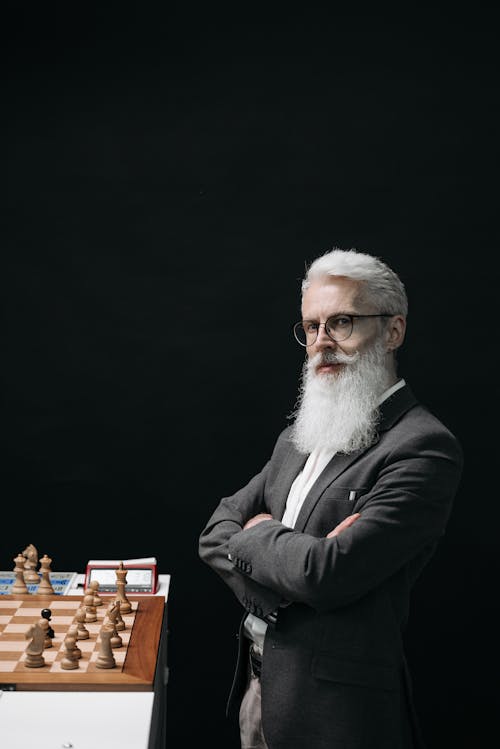 A Bearded Man Playing Chess