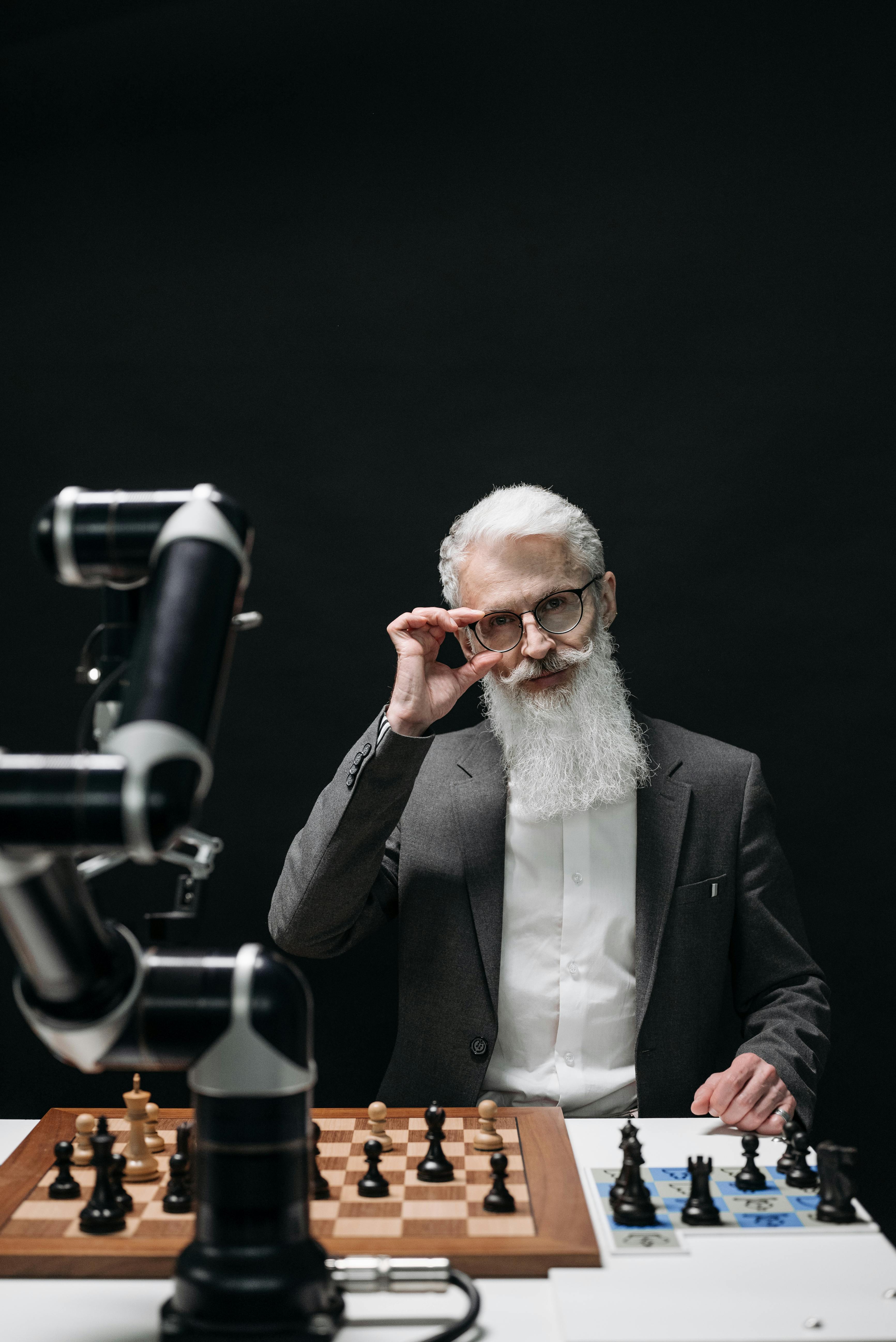 Man playing chess against computer - Stock Image - Everypixel