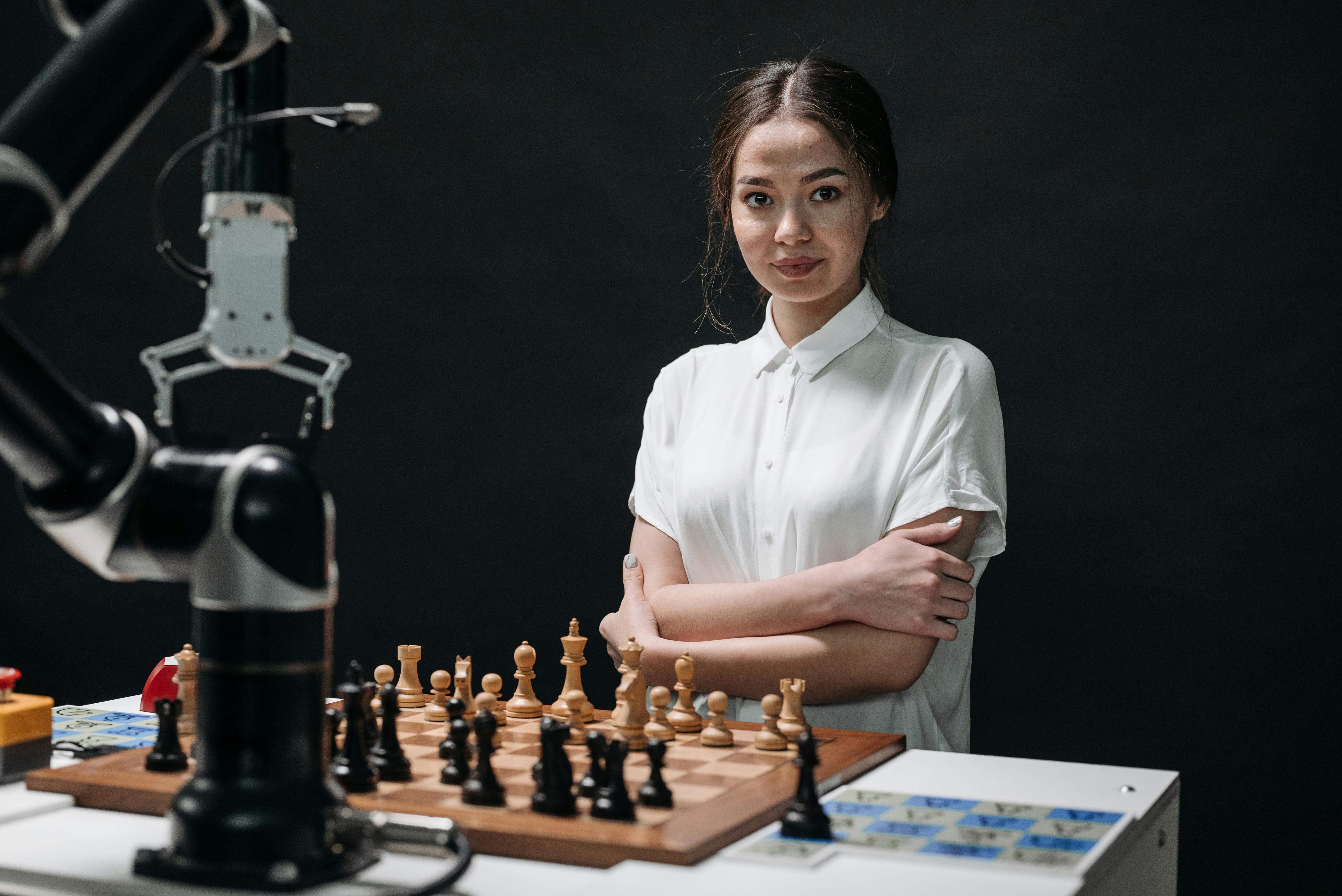 woman in white blouse playing chess