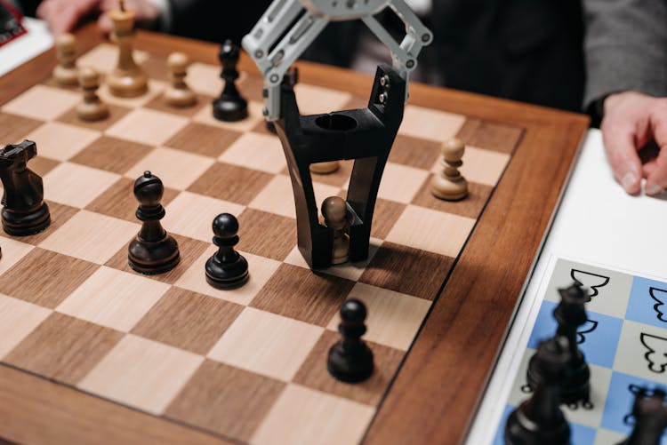 Robot Picking A Chess Piece