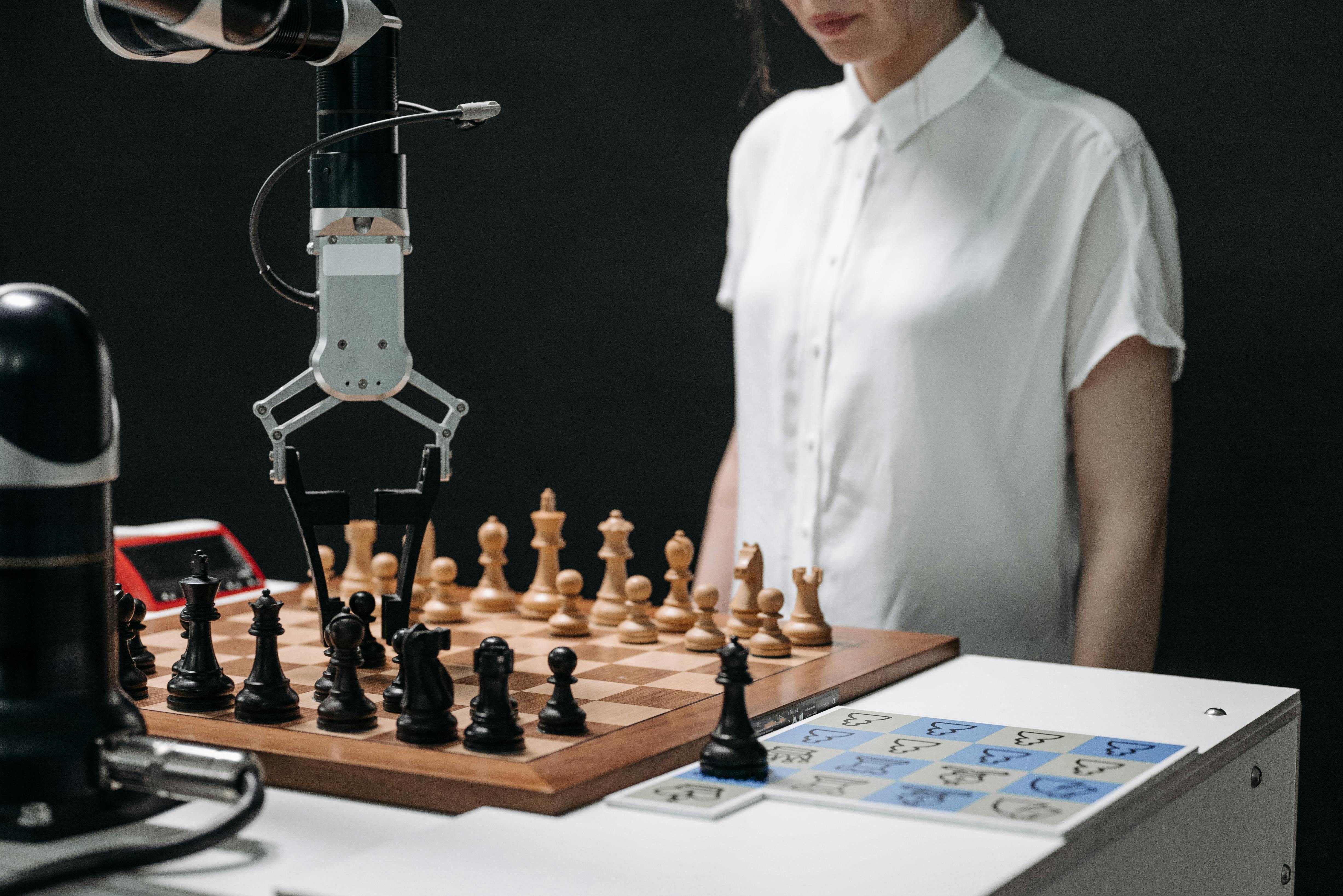 a robotic arm picking up a chess piece on a chessboard