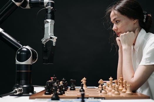 Woman strategizing a chess game against a robot arm, illustrating technology and strategy.