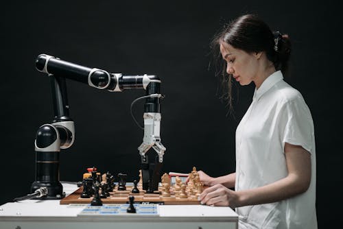 Free A Woman Playing Chess Stock Photo