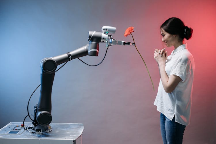 A Robot Holding A Flower