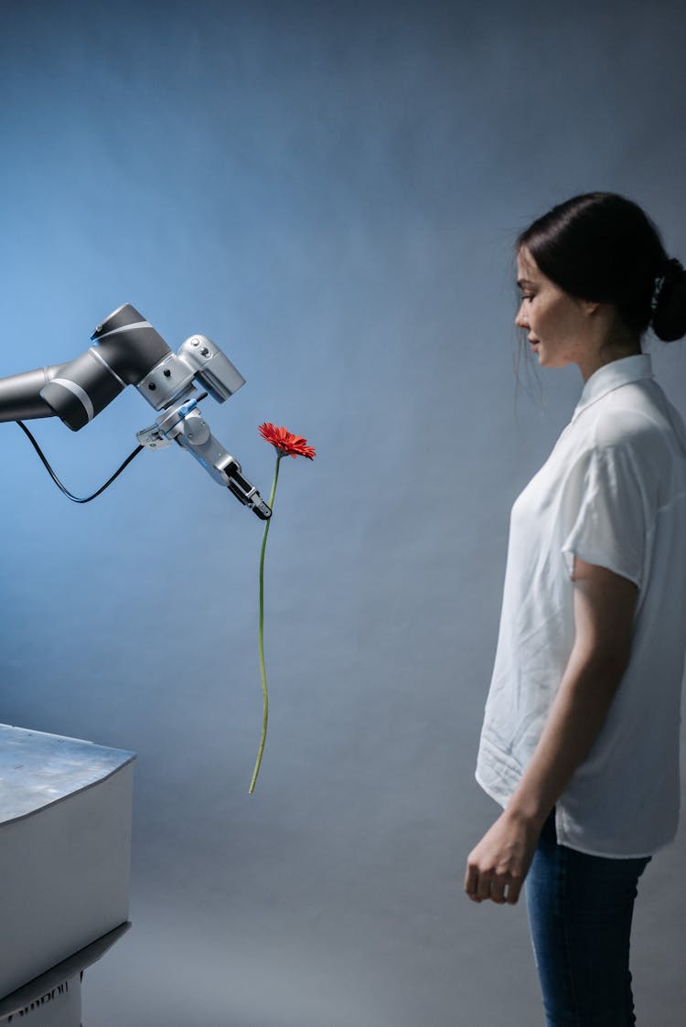 A Robot Giving A Woman A Flower