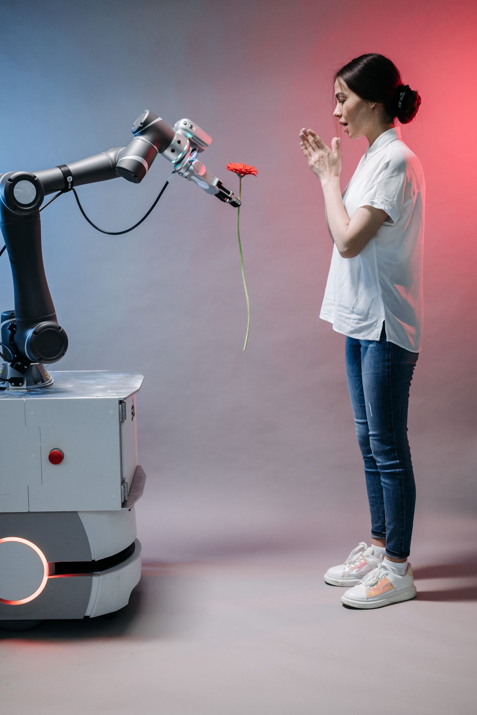 Robotic arm and a person reaching toward each other