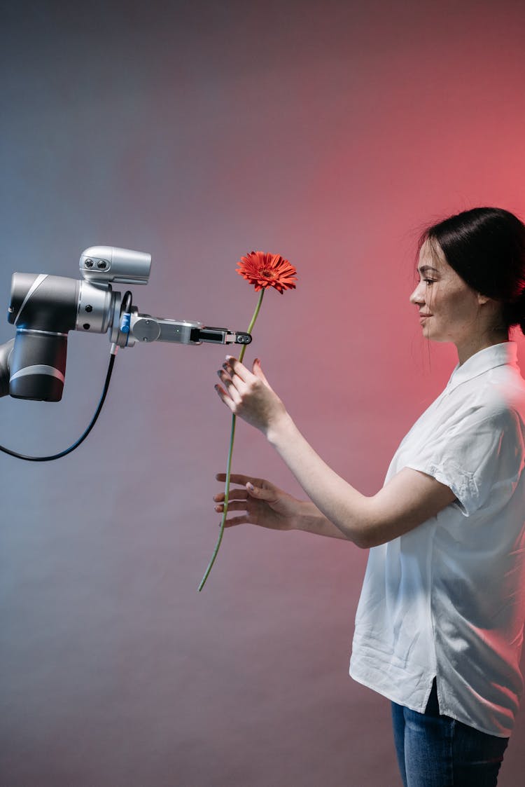 A Robot Holding A Flower