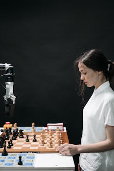 A woman engaged in a strategic chess game with a robotic arm, highlighting AI innovation.