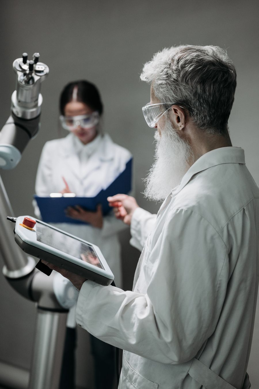 Researchers working with a robot — Pavel Danilyuk on Pexels