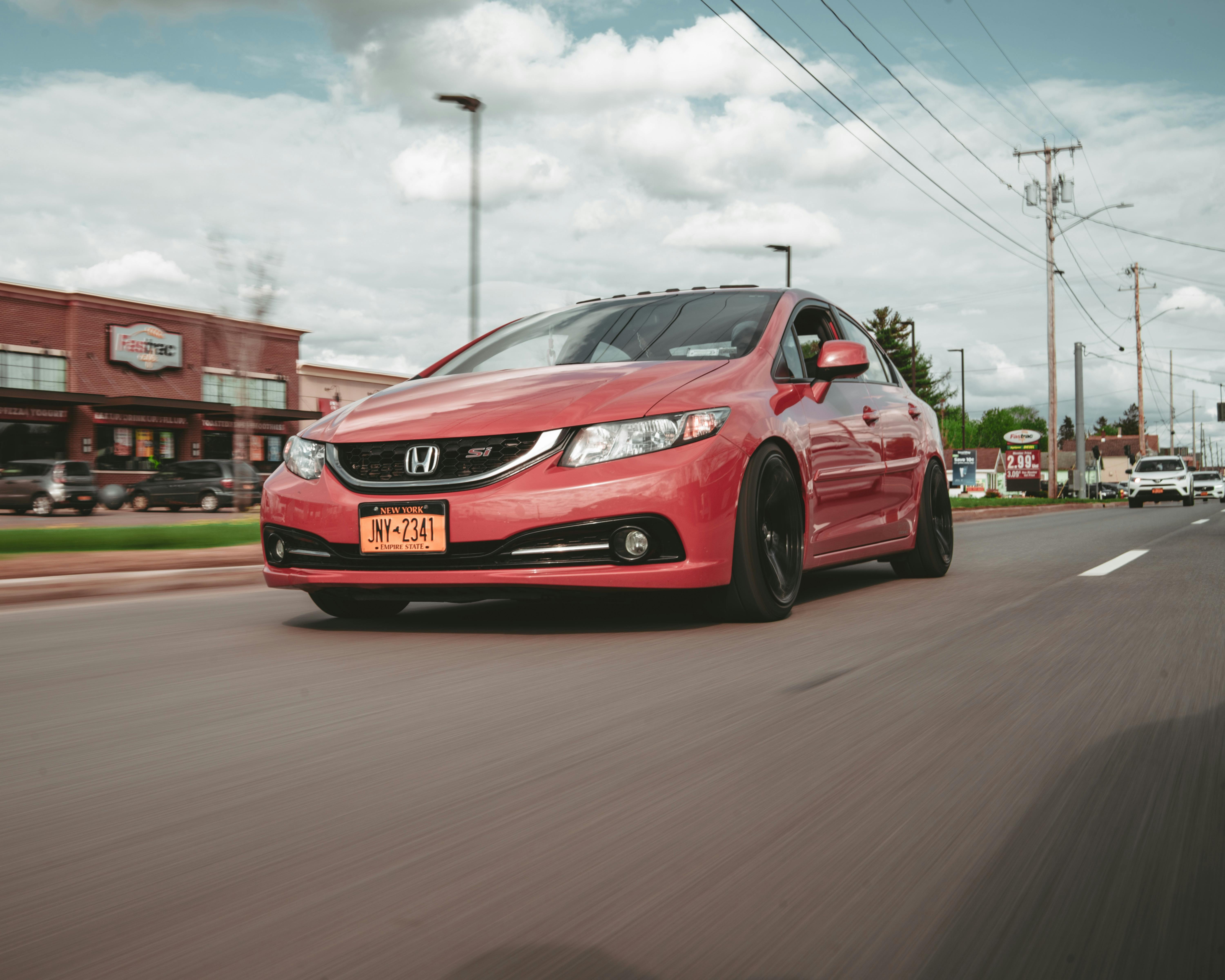 A Red Car on the Road · Free Stock Photo