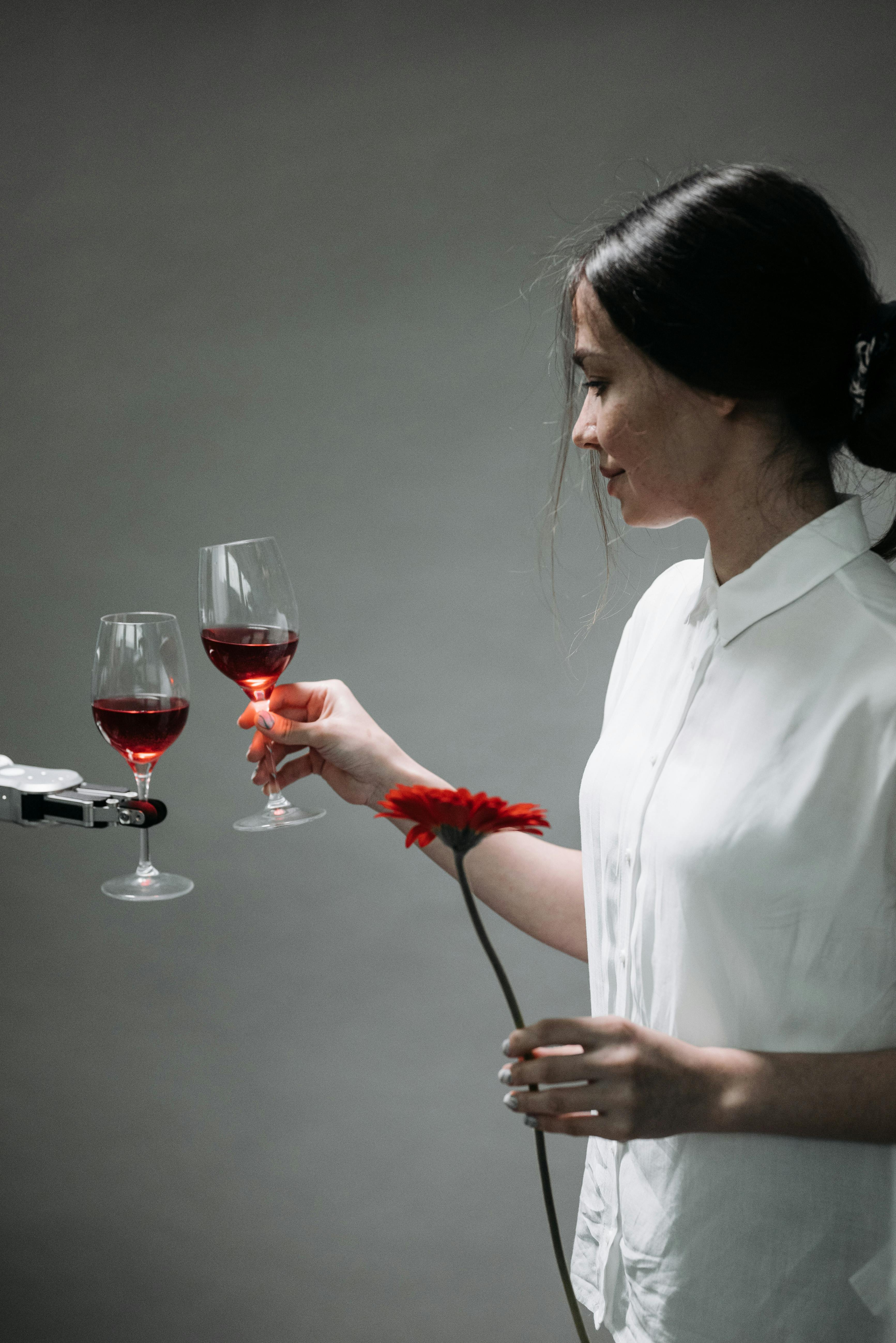 a robot holding a wine