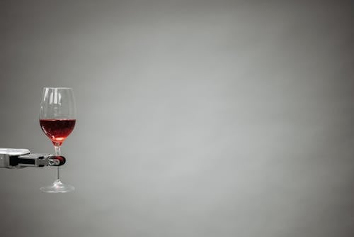 A Robot Holding a Wine