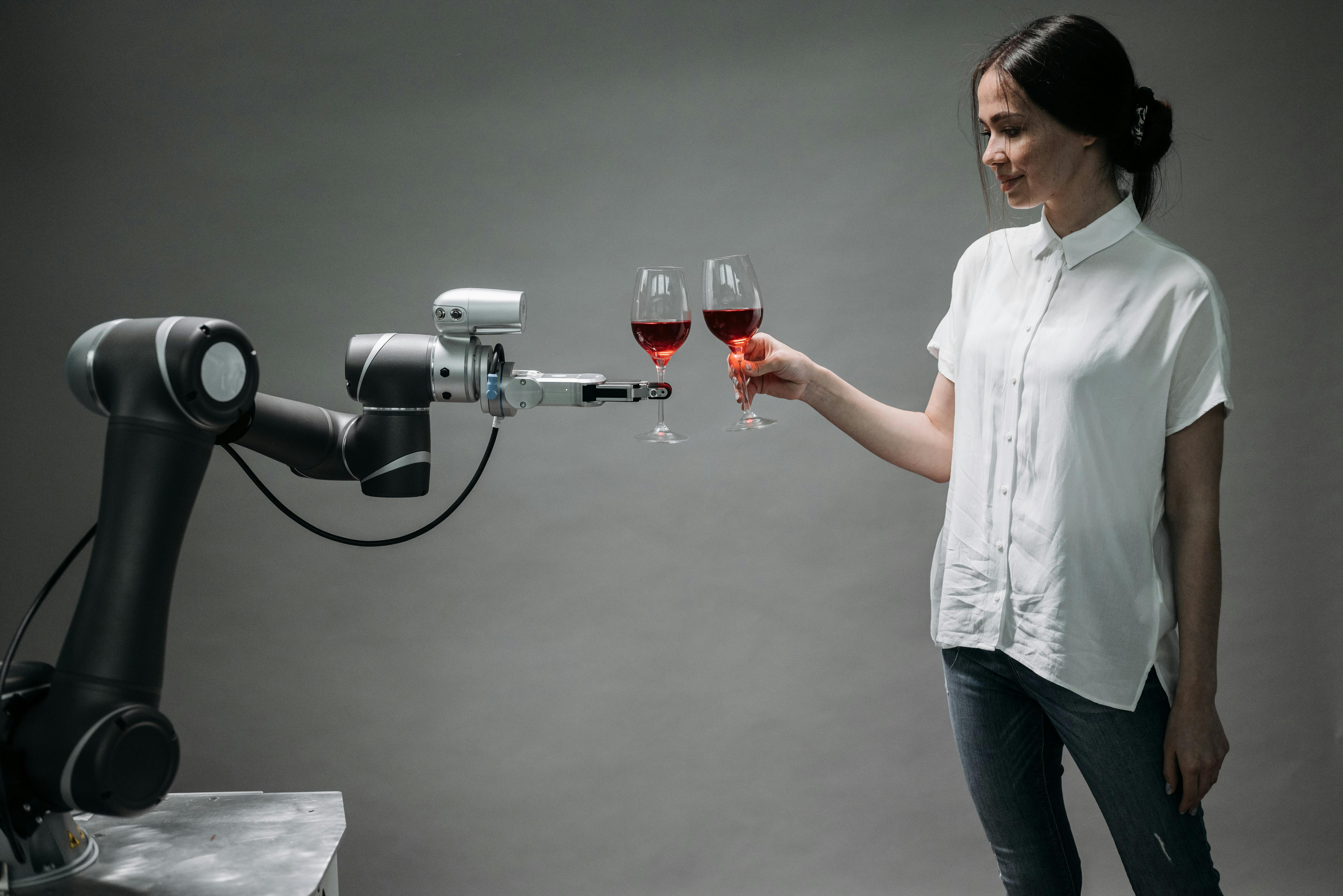 a robot holding a wine