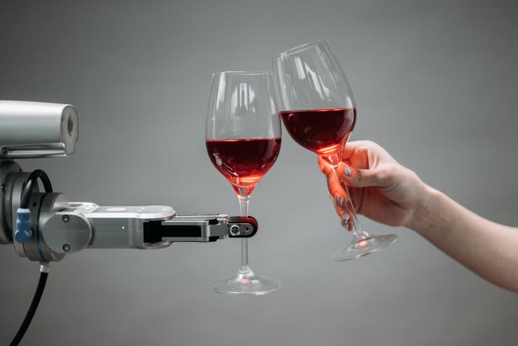 A Robot Holding A Wine