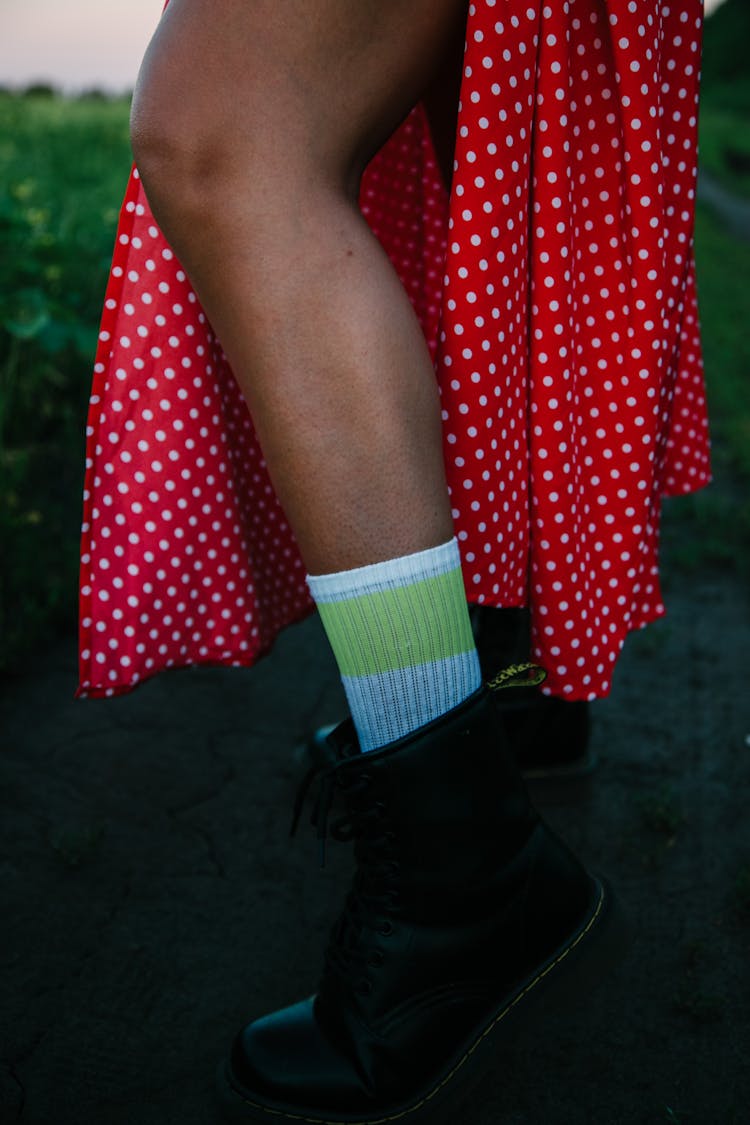Close-up Woman Wearing Boots, Midi Dress And Socks 