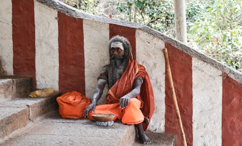 Man Sitting on Stairs