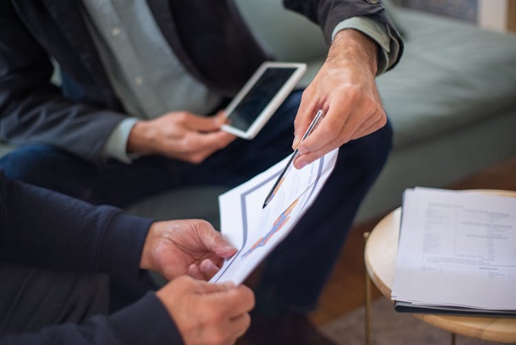  A Person Holding A Document 