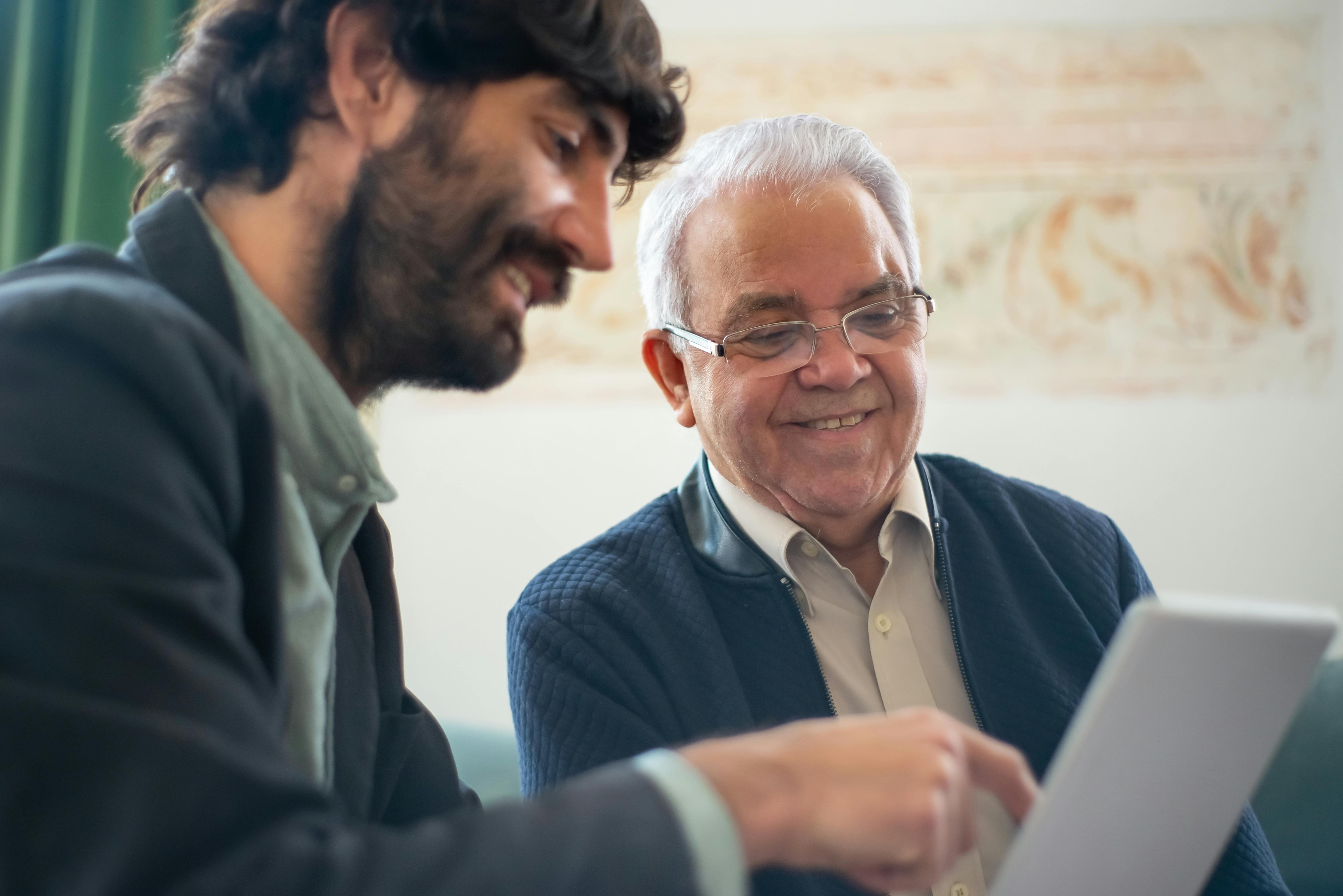 men looking at a laptop