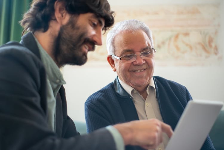 Men Looking At A Laptop