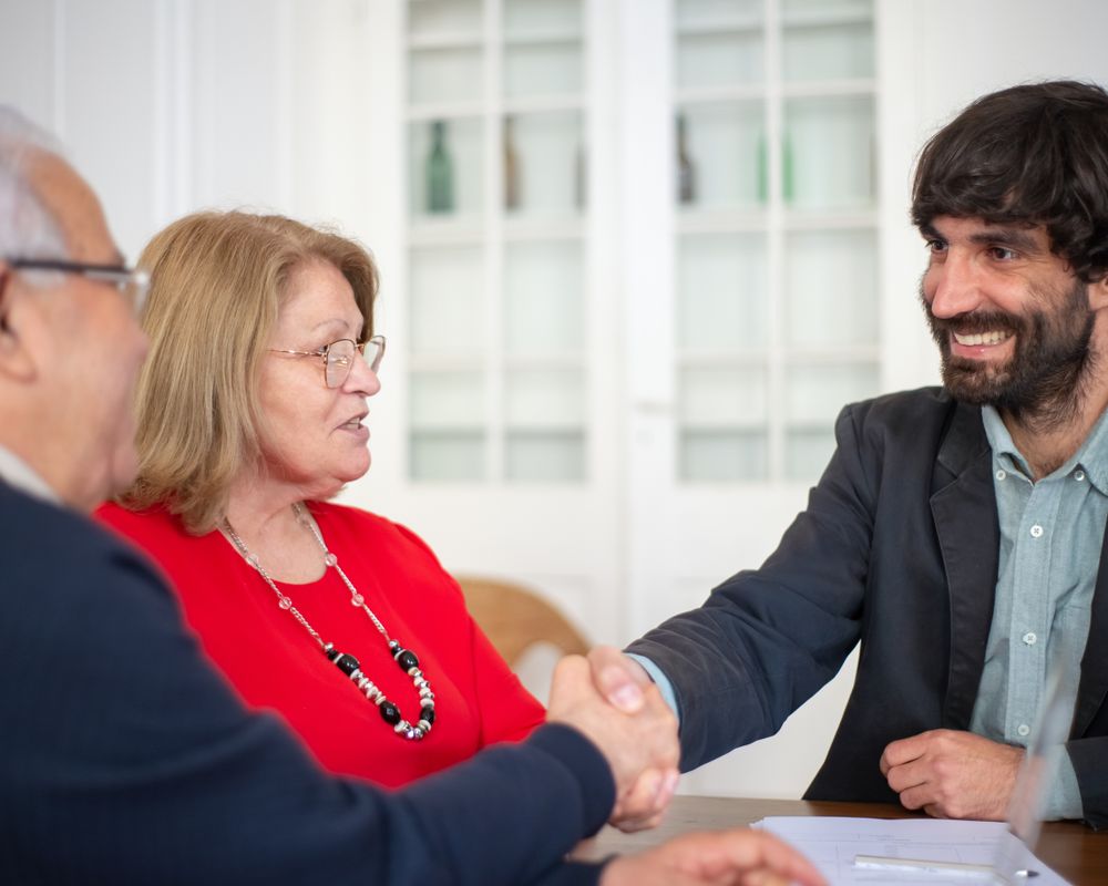 Consultant shaking hands with a happy client