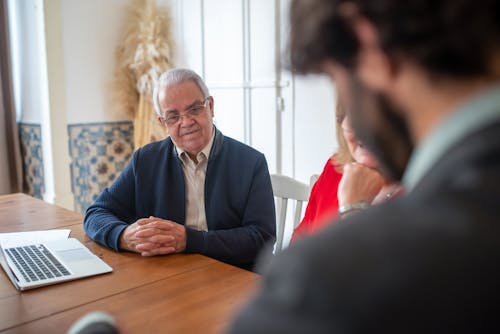 Free Clients Consulting an Accountant Stock Photo