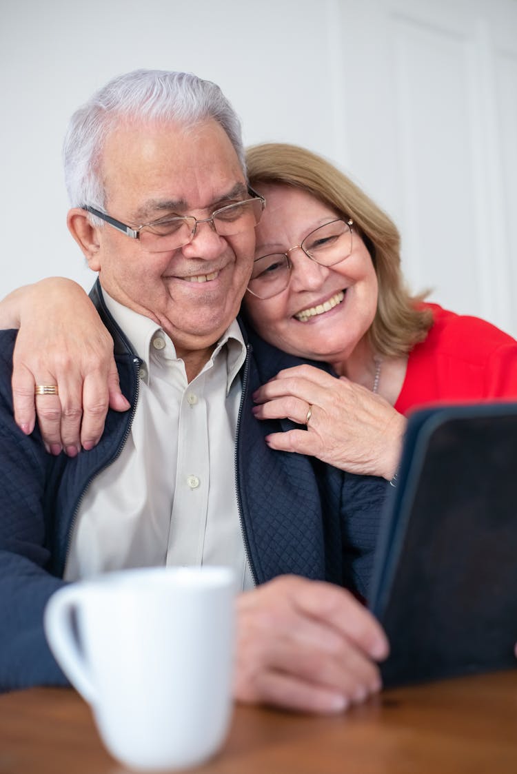 Smiling Elderly Couple Having A Video Call