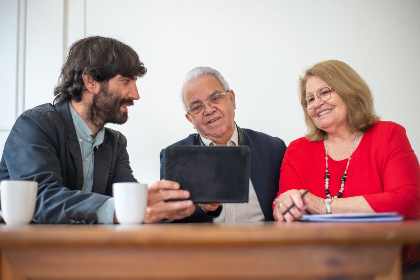 Couple discussing retirement and insurance options with an advisor