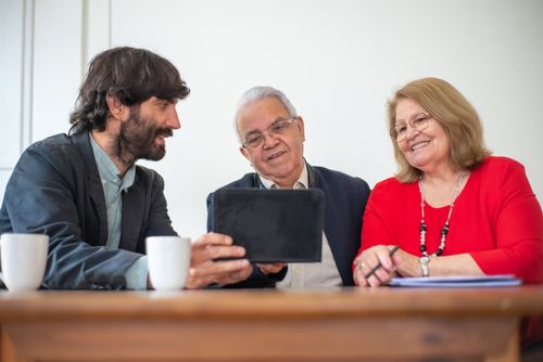 Free Elderly couple in a meeting with consultant, exploring financial or insurance options. Stock Photo