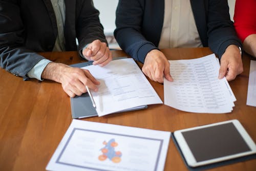 Office Workers Looking at Documents during a Business Meeting