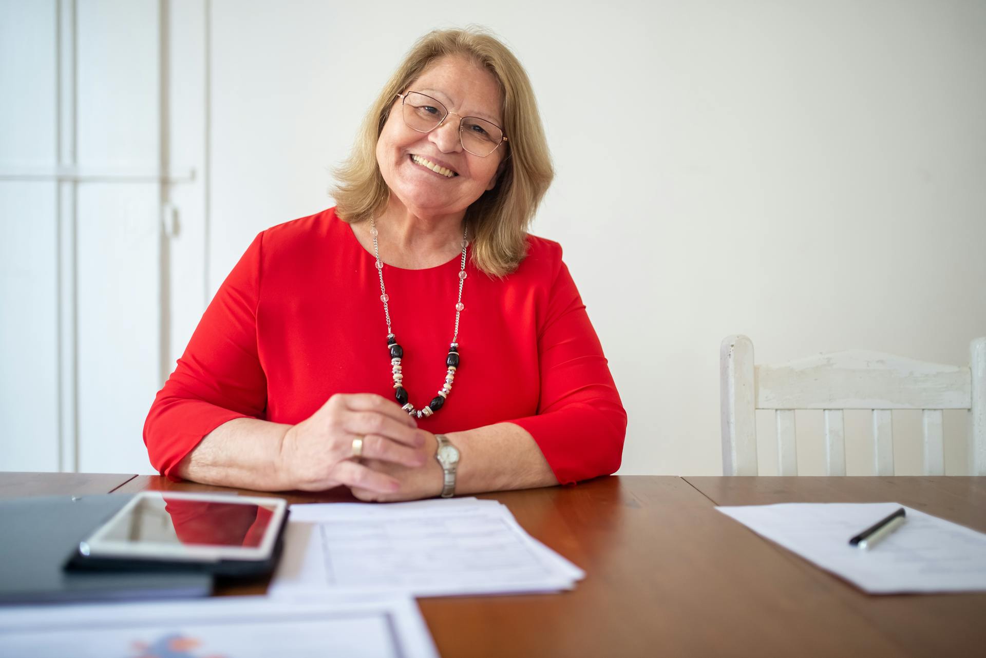 A Woman with Documents on the Table