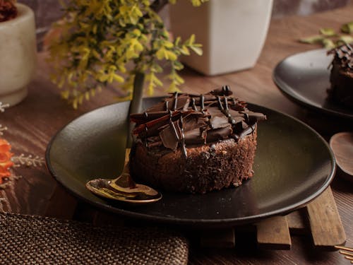 Free Chocolate Cake on Black Round Plate Stock Photo