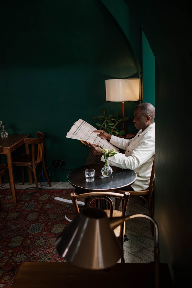 A Man Reading A Newspaper