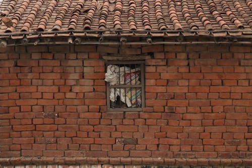 Old Redbrick Building with Bars in the Window 