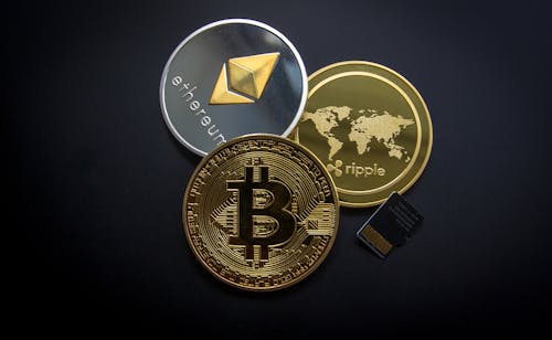 Free Ripple, Etehereum and Bitcoin and Micro Sdhc Card Stock Photo