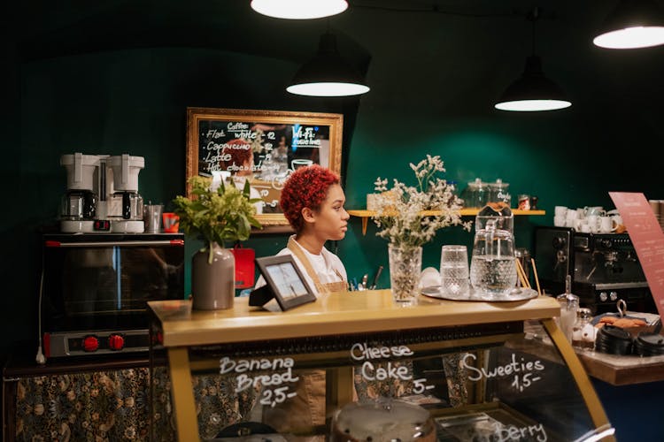 Waitress Behind A Counter In A Restaurant 